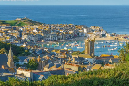 St Ives is a seaside town, civil parish and port in Cornwall, England. The town lies north of Penzance and west of Camborne on the coast of the Celtic Sea and it is now primarily a popular holiday resort, notably achieving the title of Best UK Seaside Town from the British Travel Awards in both 2010 and 2011.